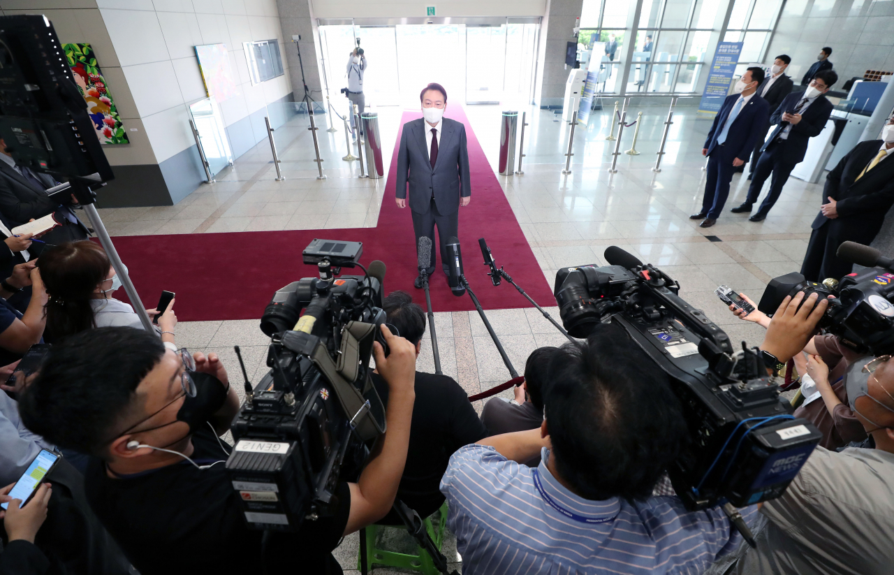 President Yoon Suk-yeol speaks to reporters as he arrives at the presidential office in Seoul on Thursday. (Yonhap)