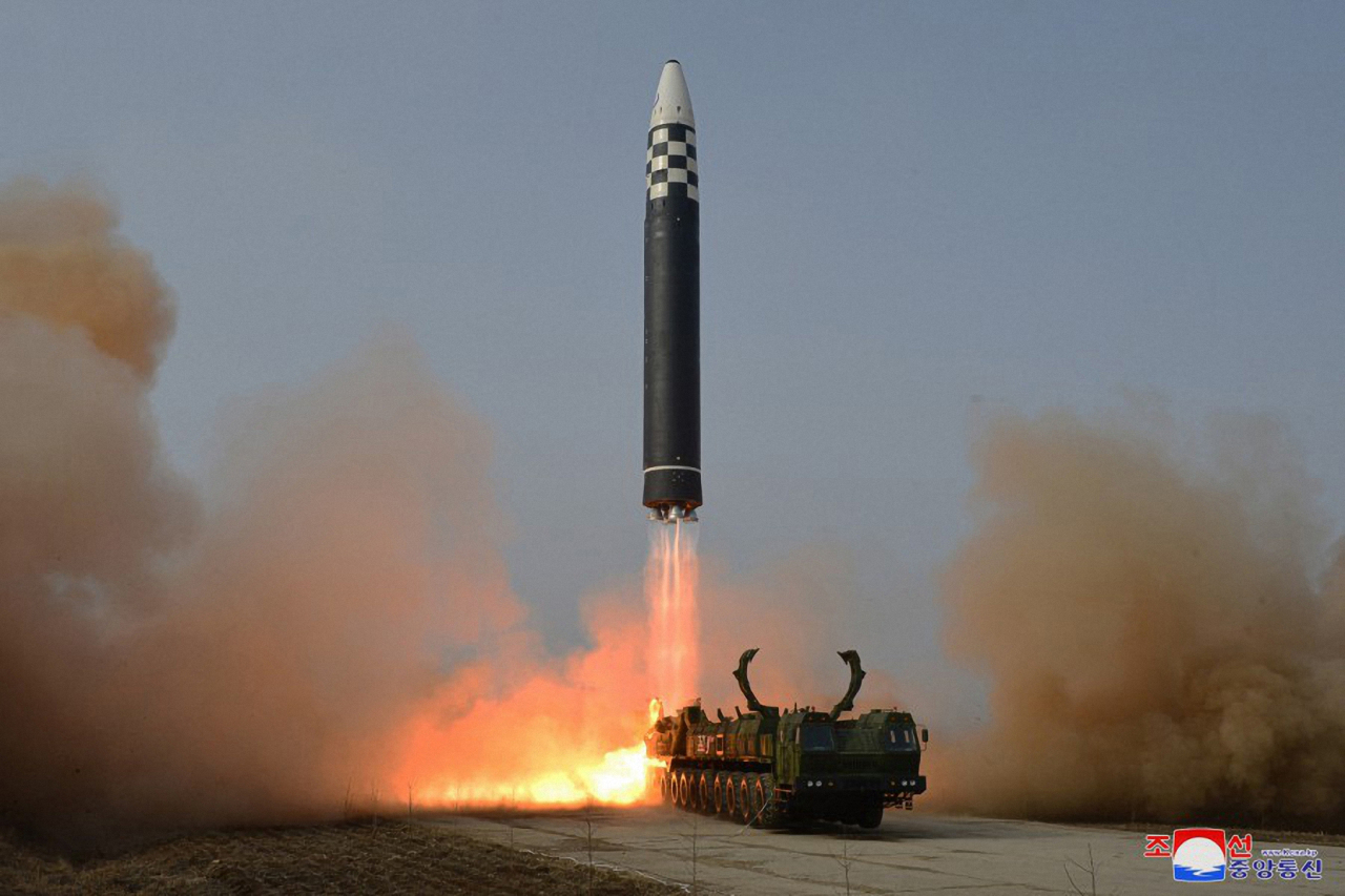 An intercontinental ballistic missile (ICBM) is launched from Pyongyang International Airport on March 24, in this photo released by North Korea's official Korean Central News Agency. North Korean leader Kim Jong-un approved the launch, and the missile traveled up to a maximum altitude of 6,248.5 kilometers and flew a distance of 1,090 km before falling into the East Sea, the KCNA said. (KCNA)