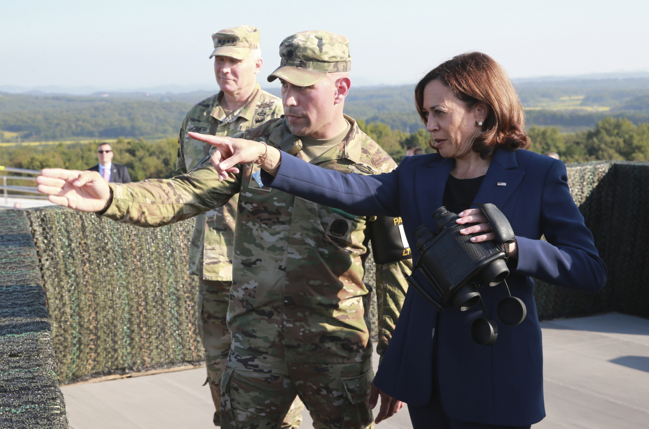 US Vice President Kamala Harris (R) looks at North Korea from Observation Post Ouellette inside the Demilitarized Zone separating Korea at the western section of the inter-Korean border in Paju, north of Seoul, on Thursday. (Yonhap)