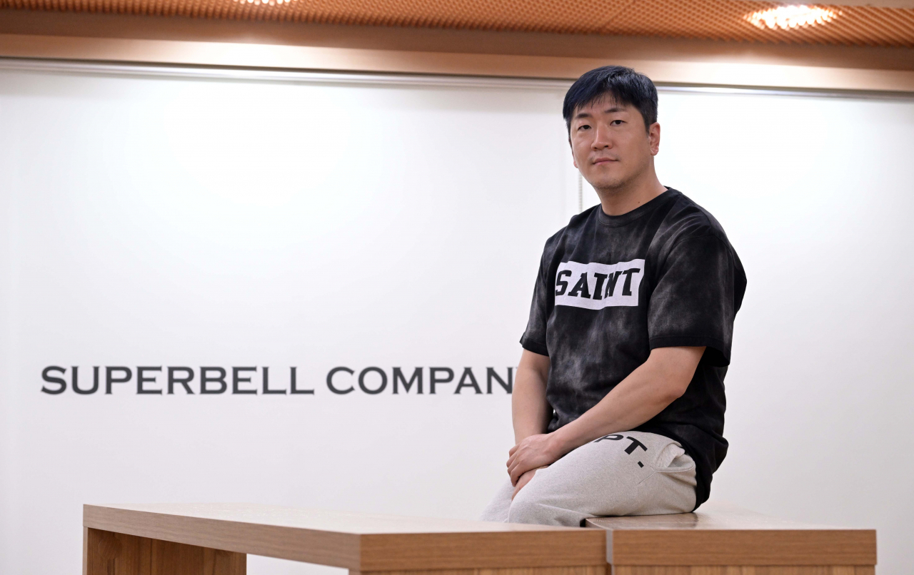 Veteran K-pop producer Ryan Jhun poses for a photo during a recent interview with The Korea Herald at Superbell Company's headquarters in Mapo-gu, western Seoul. (Lee Sang-sub/The Korea Herald)