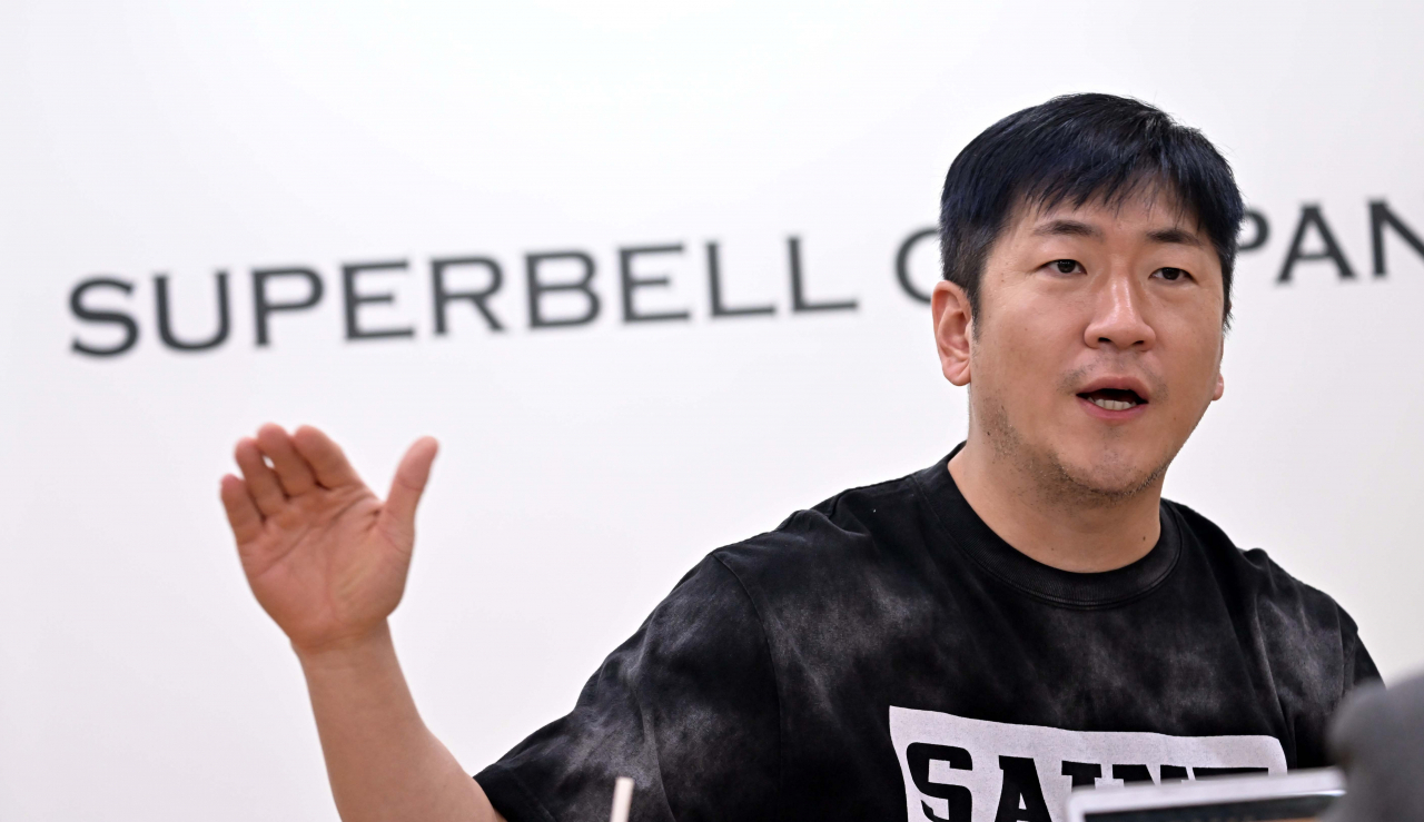 Veteran K-pop producer Ryan Jhun speaks in an interview with The Korea Herald at Superbell Company's headquarters in Mapo-gu, western Seoul. (Lee Sang-sub/The Korea Herald)