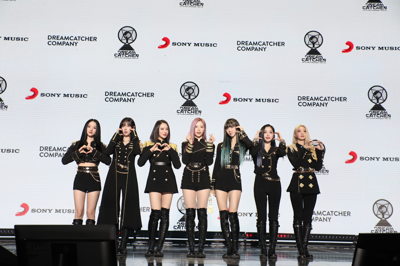 K-pop girl group Dreamcatcher poses for photos during a press showcase event for its seventh EP “Apocalypse: Follow Us,” held at Konkuk University in Seoul, Tuesday. (Dreamcatcher Company)