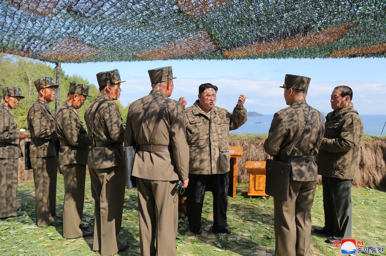 This photo, released by the Korean Central News Agency (KCNA) on Monday, shows North Korean leader Kim Jong-un overseeing his military's major training. The agency reported that Kim inspected an exercise of tactical nuclear operation units to assess the 