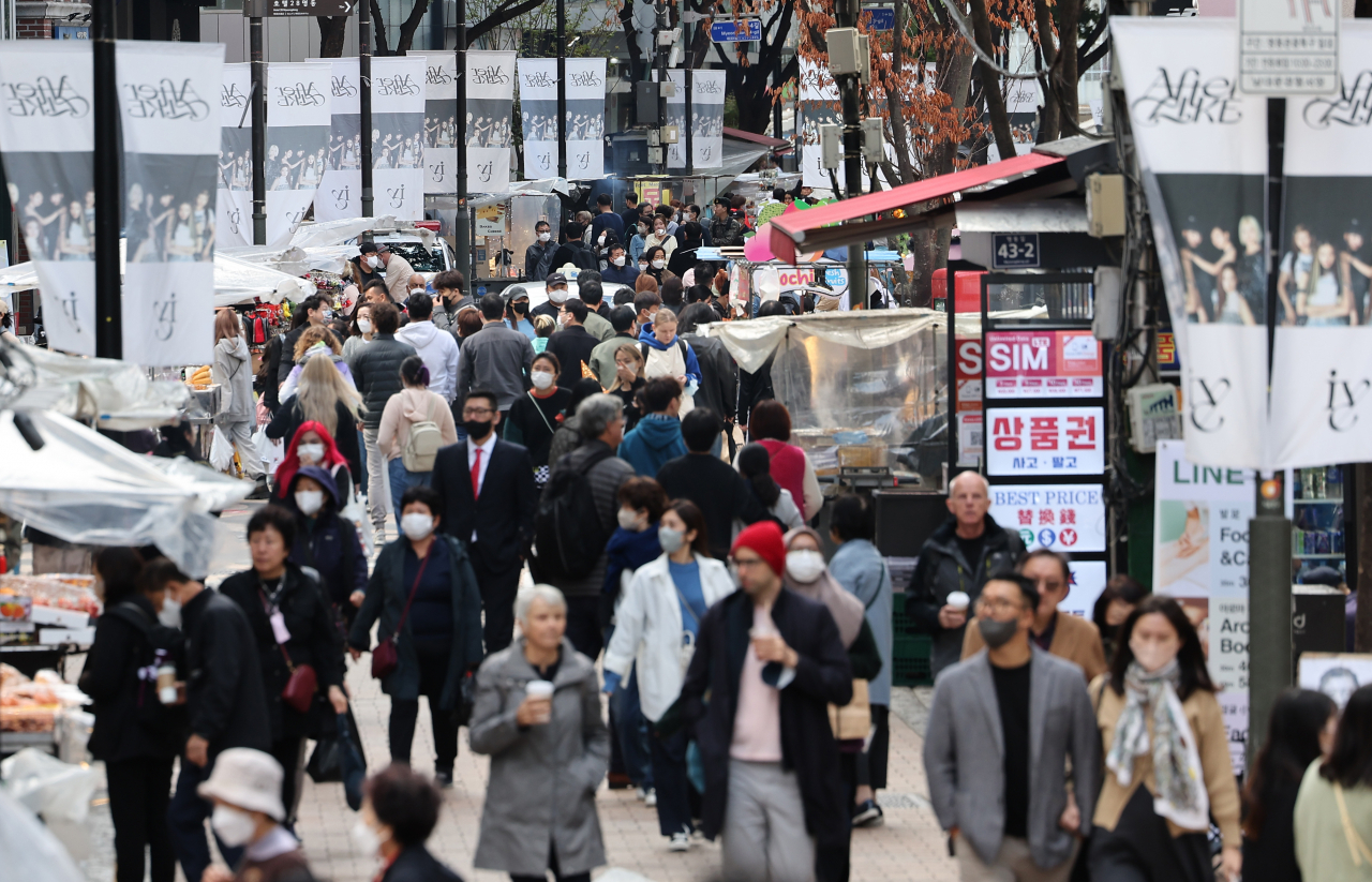 The shopping district of Myeong-dong in Seoul bustles with tourists on Monday (Yonhap)