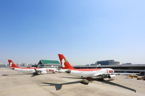 This file photo provided by T'way Air shows its A330-300 chartered planes at Incheon International Airport, west of Seoul. (T'way Air)