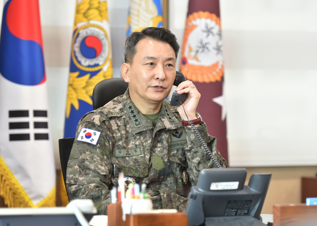 South Korea's Joint Chiefs of Staff (JCS) Chairman Gen. Kim Seung-kyum talks over the phone with his U.S. counterpart, Gen. Mark Milley, in Seoul on Oct. 5, one day after North Korea's intermediate-range ballistic missile launch into the Pacific the previous day. The JCS provided this photo. (JCS)