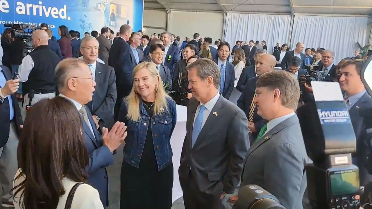 This photo taken on Wednesday shows Hyundai Motor Group Chairman Euisun Chung (second from left) talking to participants during a groundbreaking ceremony for the group's dedicated EV plant named Hyundai Motor Group Metaplant America in Bryan County, Georgia. (Yonhap)
