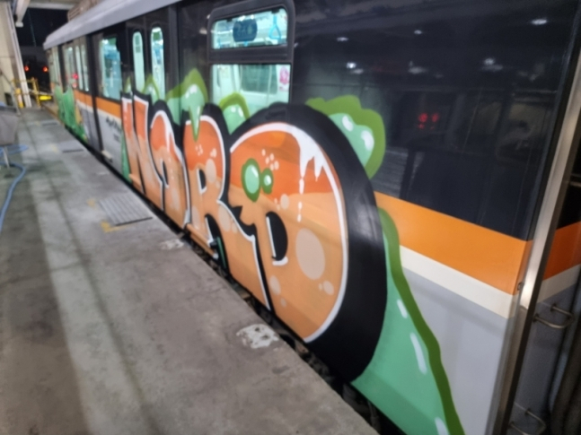 Graffiti is seen on a subway train at a subway car depot in Incheon. (Incheon Transit Corp.)