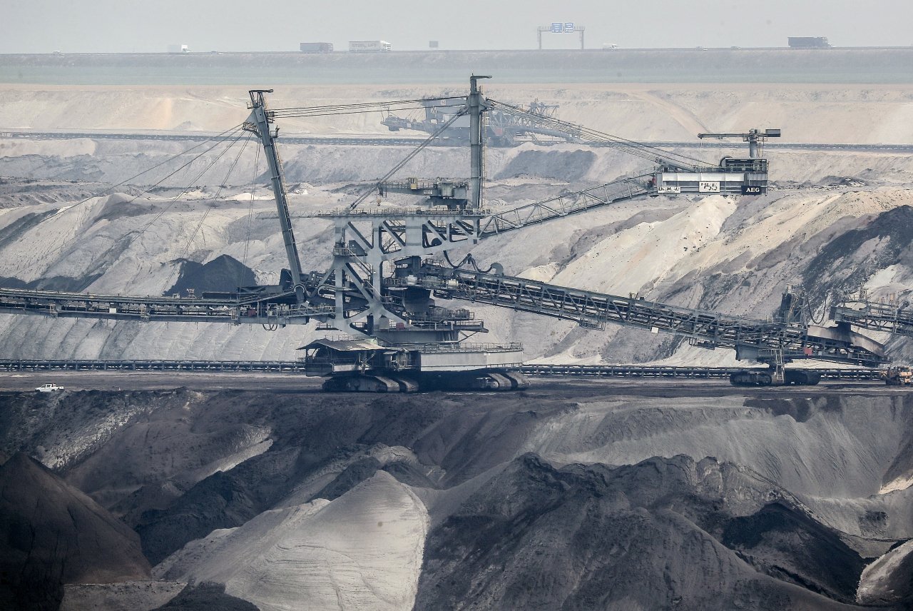 Giant bucket-wheel excavators extract coal at the controversial RWE Garzweiler surface coal mine near Jackerath, west Germany, April 29, 2021. (AP-Yonhap)
