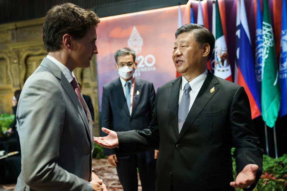 Canada`s Prime Minister Justin Trudeau speaks with China`s President Xi Jinping at the G20 Leaders` Summit in Bali, Indonesia, November 16, 2022. Adam Scotti/Prime Minister`s Office/Handout via REUTERS.