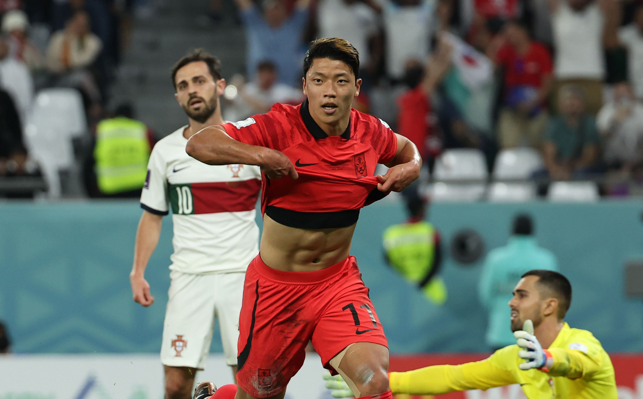 South Korea's Hwang Hee-chan celebrates after scoring his team's second goal during the Qatar 2022 World Cup Group H football match between South Korea and Portugal at the Education City Stadium in Al-Rayyan, Qatar on Saturday. (Yonhap)