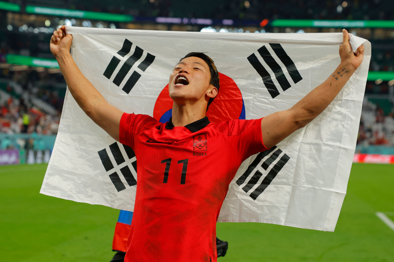 South Korea's midfielder Hwang Hee-chan celebrates at the end of the Qatar 2022 World Cup Group H football match between South Korea and Portugal at the Education City Stadium in Al-Rayyan, west of Doha on Friday. (AP)