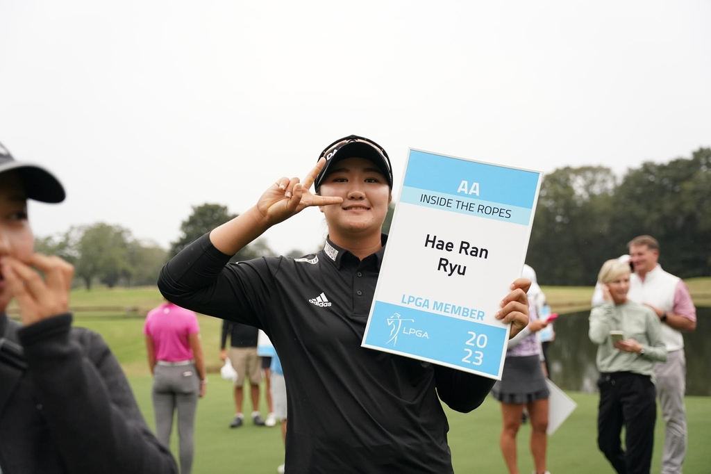 Ryu Hae-ran of South Korea poses with a card bearing her name as a new member of the LPGA Tour for 2023, following her victory at the LPGA Q-Series at Highland Oaks Golf Club in Dothan, Alabama, on last Sunday (the Epson Tour)