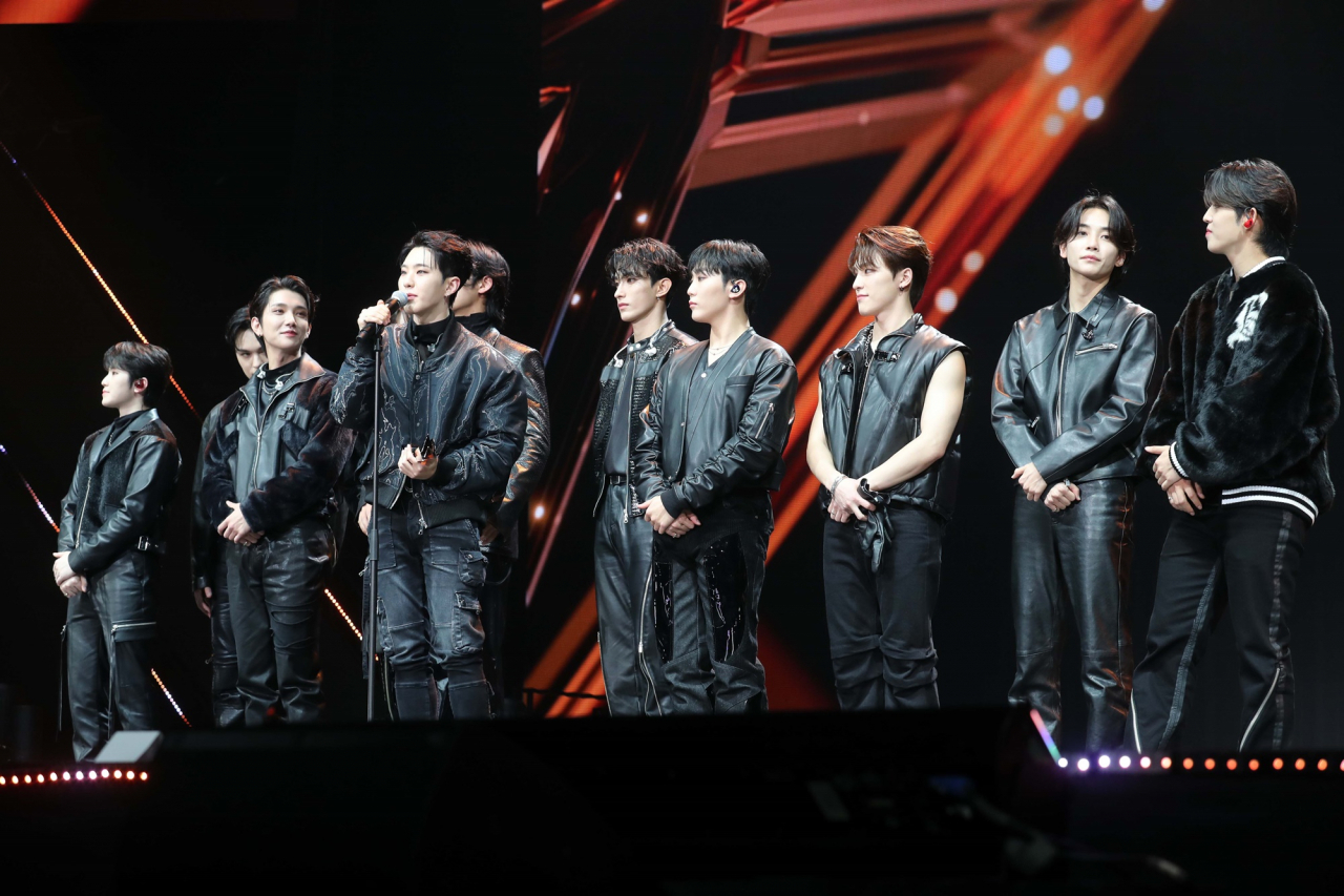 Seventeen accepts the award for singer of the year at the 2022 Asia Artist Awards held in Nippon Gaishi Hall in Nagoya, Japan, Tuesday. (AAA)