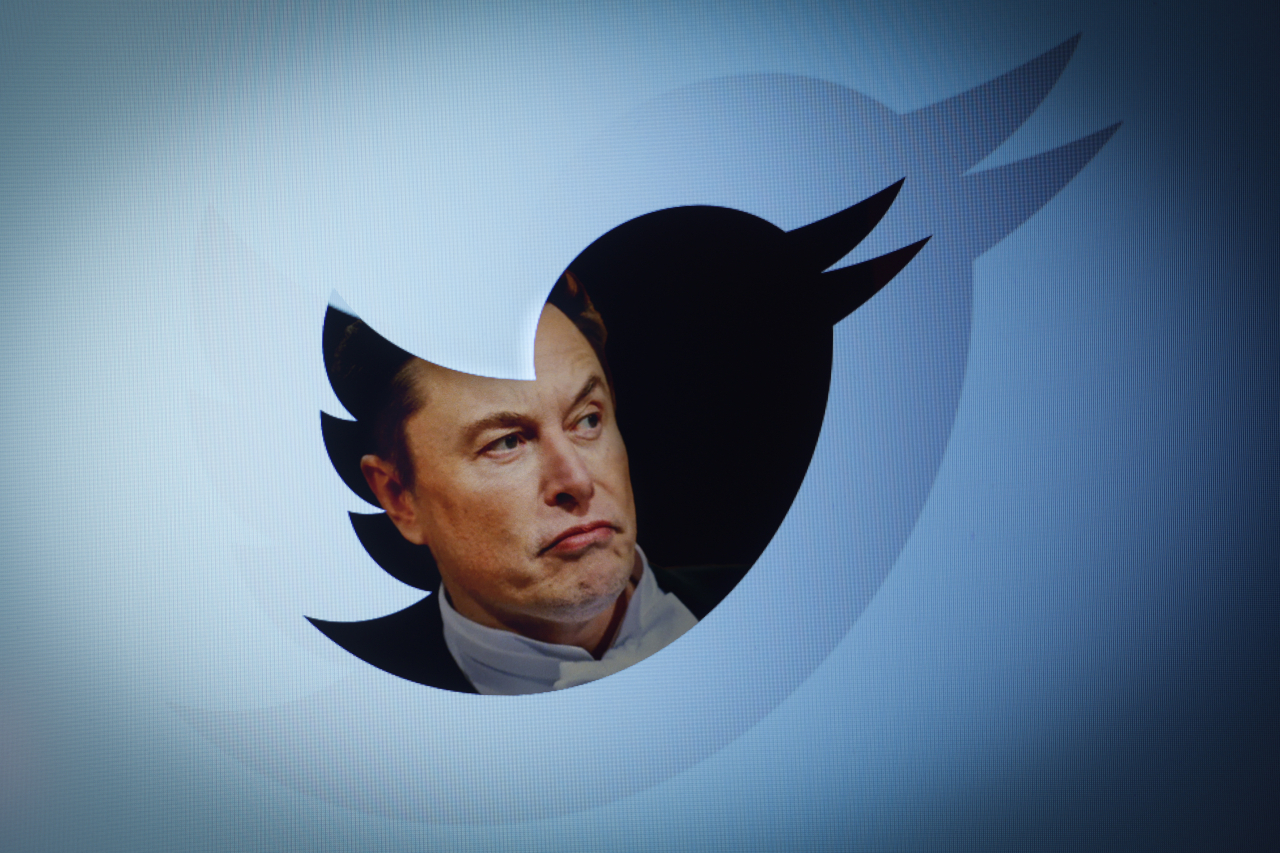 An image of Elon Musk is overlayed with a Twitter logo. (Getty Images)