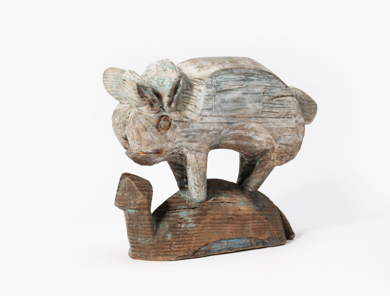 A wooden carving of a rabbit standing on the back of a terrapin, made after 1945 (NFMK)