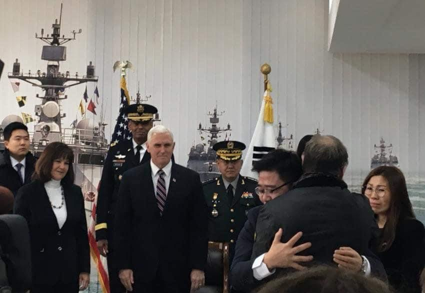 Ji Seong-ho (third from right) shares a hug with Fred Warmbier (second from right), whose son Otto died in 2017 after being held captive in North Korea, during a meeting with then-US Vice President Mike Pence (fourth from left) and his wife, Karen Pence (second from left), in February 2018. (Courtesy of Ji)