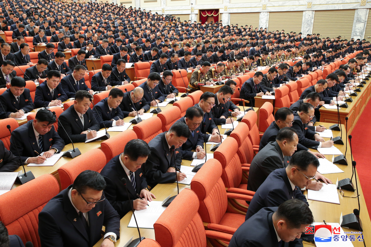 This photo from Thursday shows participants attending the third-day session of the enlarged plenary meeting of the ruling Workers' Party of Korea's central committee the previous day. (KCNA)