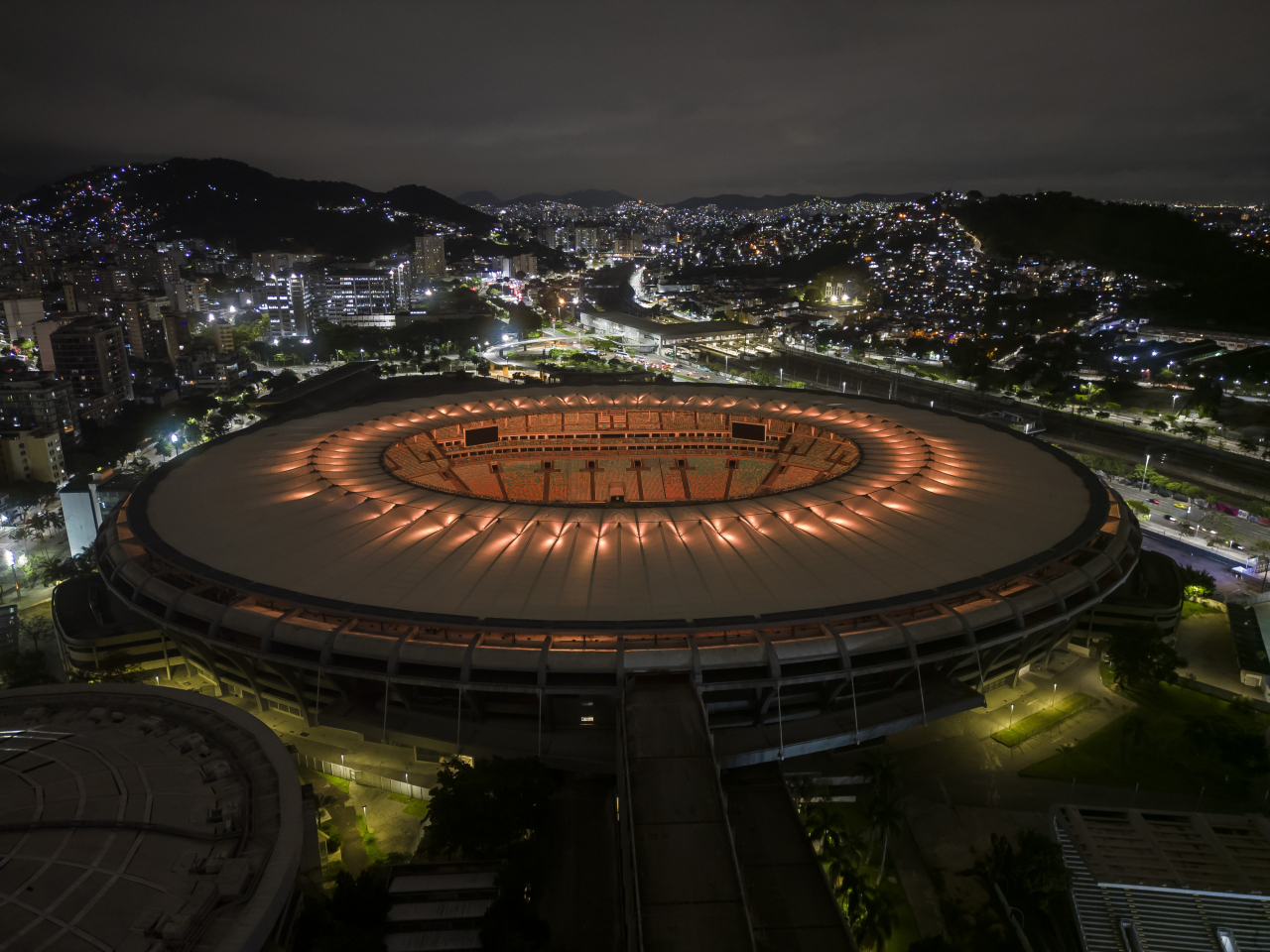 The Maracana Stadium is illuminated in yellow, one of the colors of the Brazilian national flag, to honor late soccer legend Pele in Rio de Janeiro, Brazil, Thursday. (AP)