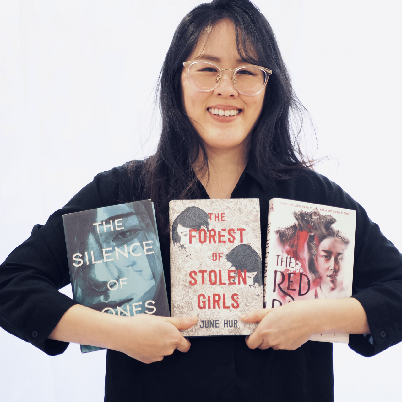 June Hur poses for a photo with her three published books. (Hur's official website)