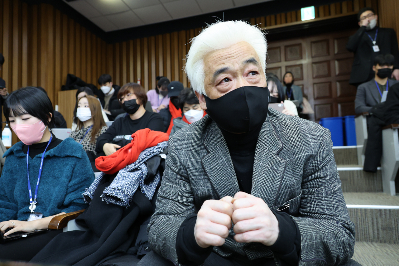 The father of late Lee Ji-han, who lost his life at 24 in the Itaewon crowd crush last year, looks on from the audience as the hearing proceeds at the National Assembly on Wednesday. (Yonhap)