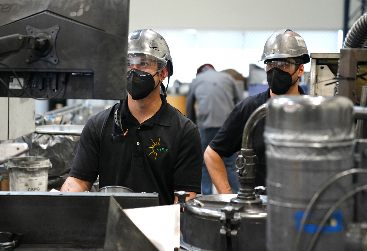 Urbix employees examine the graphite refining process in an Arizona factory in the US. (SK On)