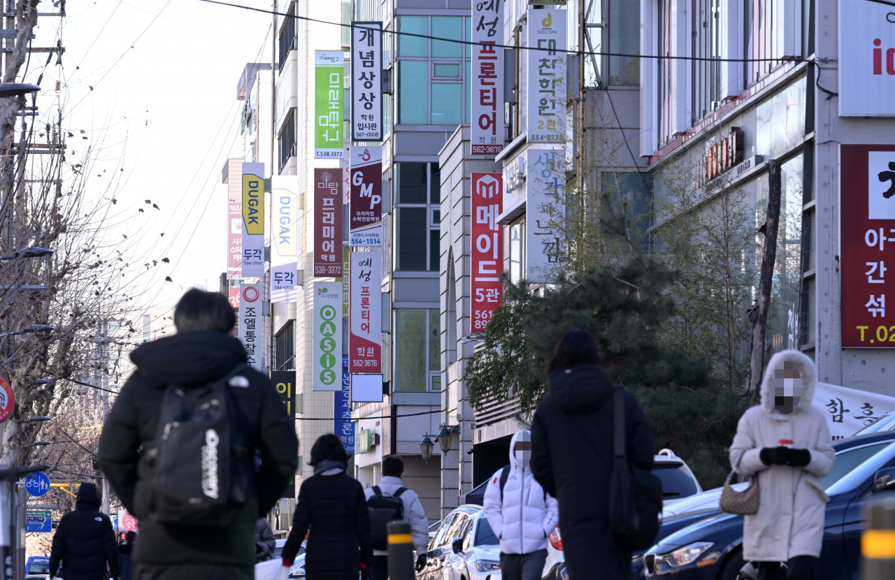 Buildings covered with hagwon signboards in Daechi-dong (Lee Sang-sub/The Korea Herald)