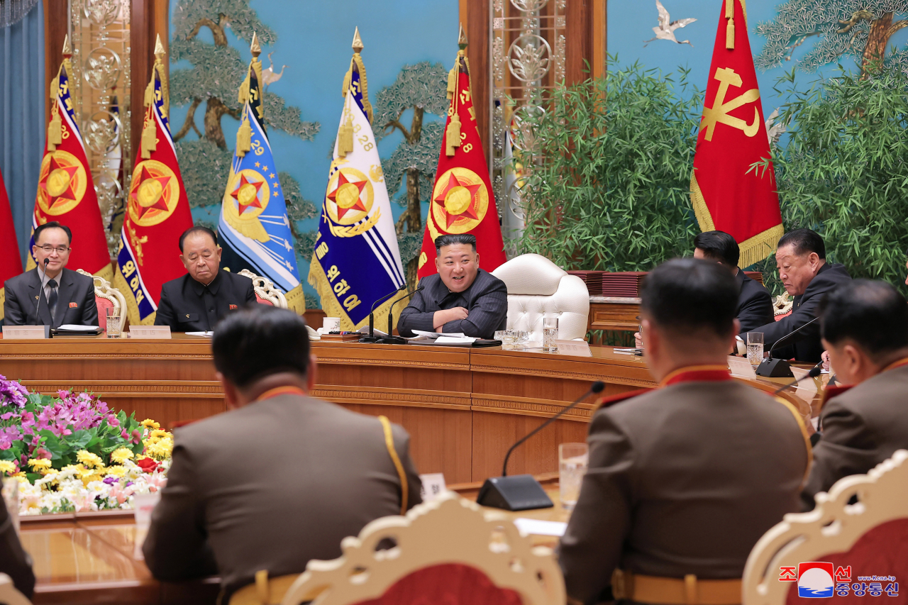 This photo shows North Korean leader Kim Jong-un (center) presiding over an enlarged meeting of the Central Military Commission of the ruling Workers' Party of Korea the previous day. (KCNA)