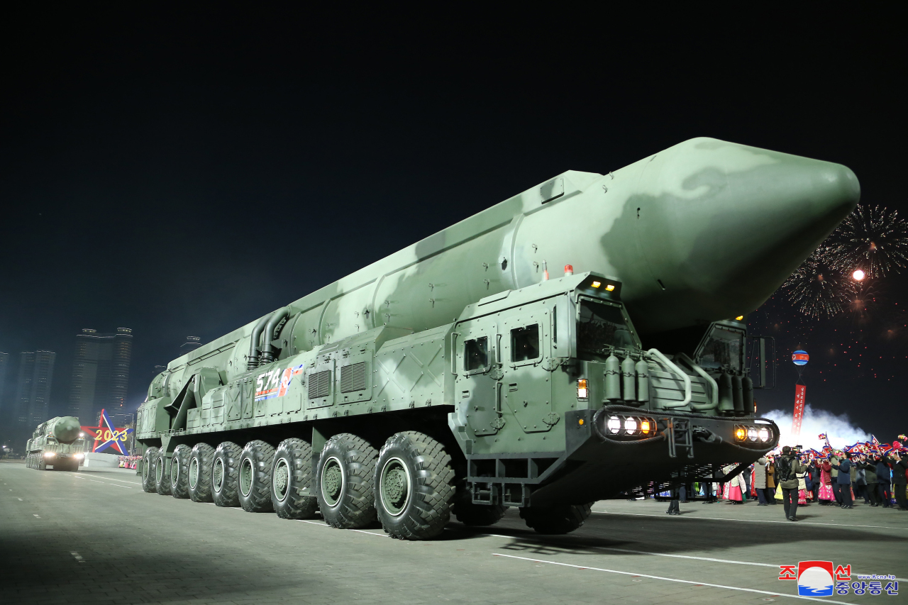 An apparent solid-fuel intercontinental ballistic missile, appears during a military parade at Kim Il Sung Square in Pyongyang on the night of Feb. 8, 2023, to mark the 75th founding anniversary of the Korea People's Army, in this photo released by the North's official Korean Central News Agency. North Korean leader Kim Jong-un attended the parade. (Yonhap)