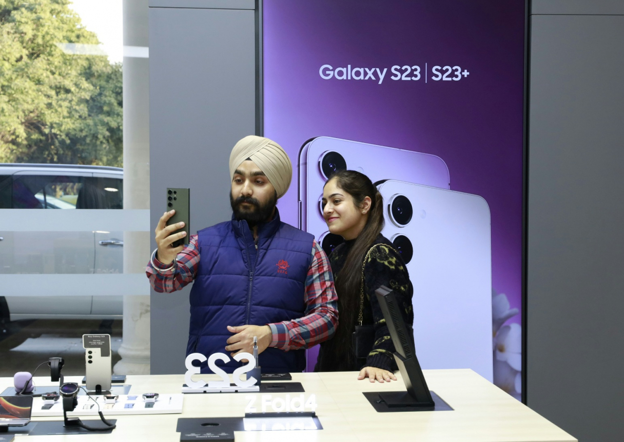 Customers try out Samsung latest smartphone model Galaxy S23 at Samsung Experience Store in Bengalore, India on Wednesday. (Samsung Electronics)