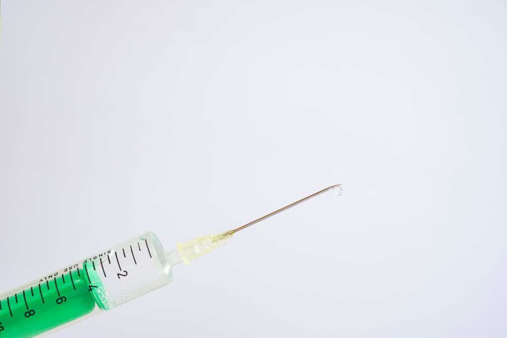 A disposable syringe with a needle (GettyImages)