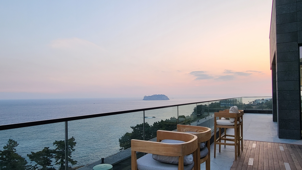 A view of Beomseom Island from the JW Marriott Jeju Resort & Spa's rooftop bar (Kim Hae-yeon/ The Korea Herald)