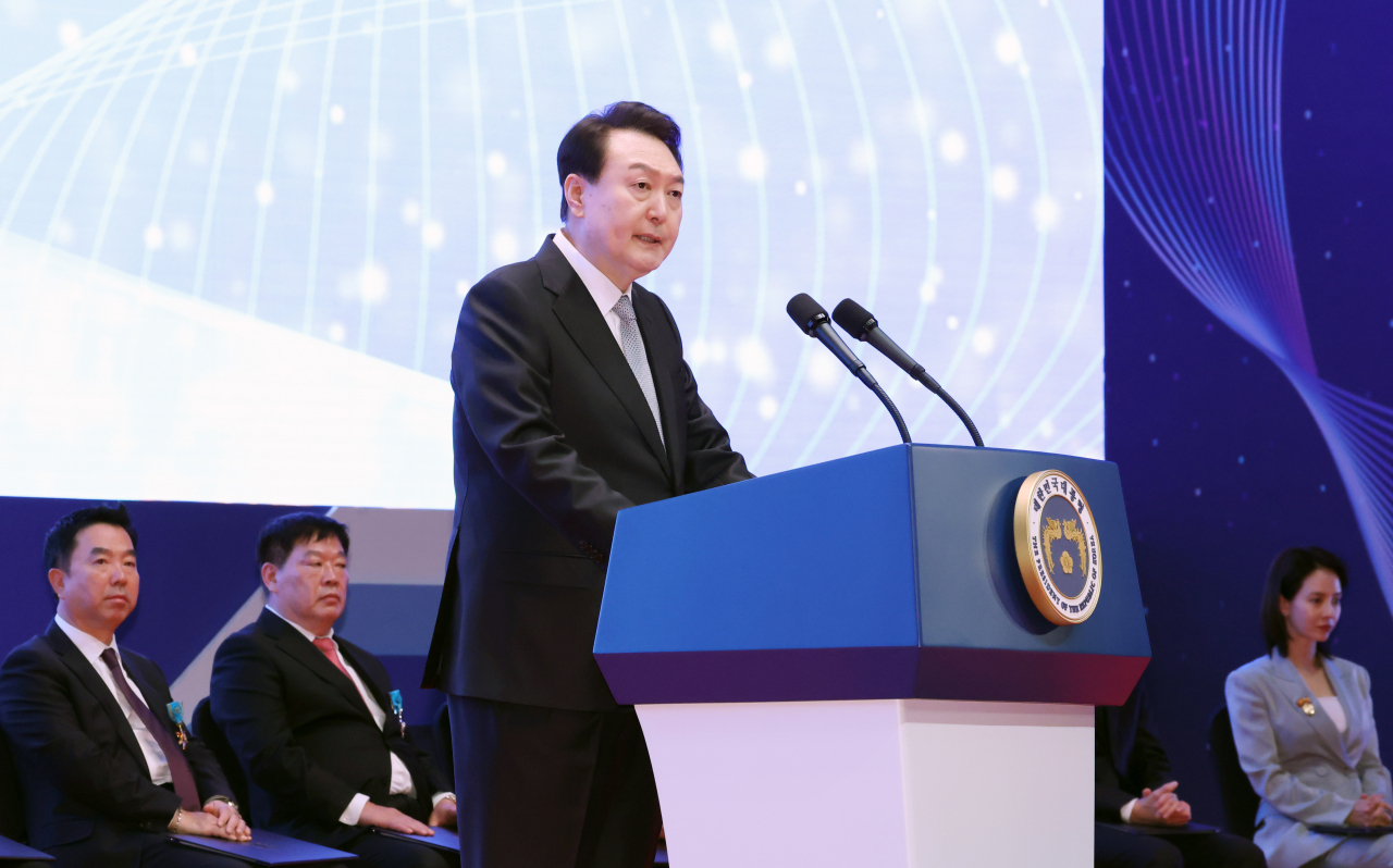 President Yoon Suk Yeol speaks during a ceremony at the COEX exhibition center in Seoul on Friday to mark the 57th Taxpayers' Day and to honor people with presidential citations for being exemplary taxpayers. (Yonhap)