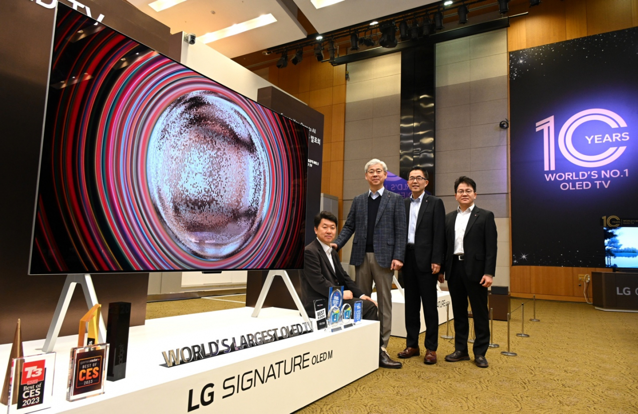 From left: LG Electronics' home entertainment product planning divison leader Baik Seon-pil, home entertainment research and development lab leader Jung Jae-chul, home entertainment platform biz division leader Jo Byoung-ha and home entertainment marketing division leader Kim Sun-hyoung pose at the company's research and development campus in Seoul, Wednesday. (LG Electronics)