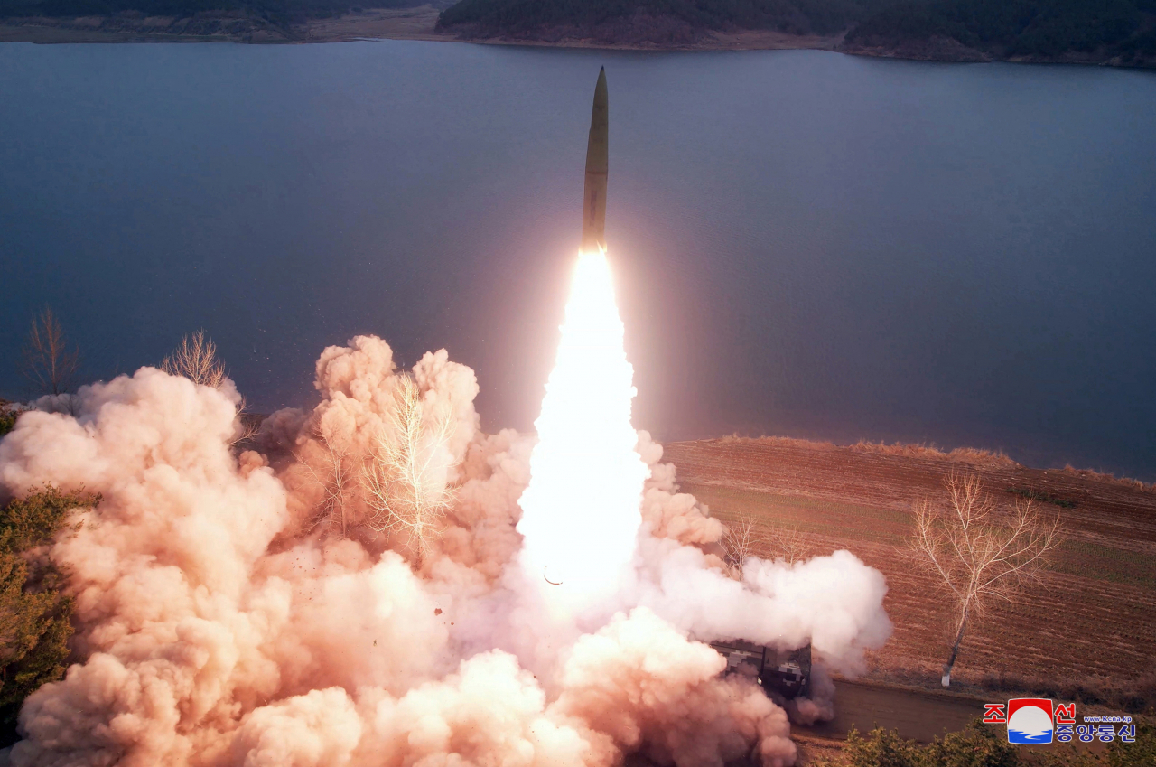 This photo shows the North firing two ground-to-ground ballistic missiles from Jangyon, South Hwanghae Province, on Tuesday. (KCNA)