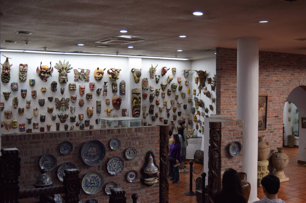 Visitors look at masks collected from the Mesoamerica region at the Latin America Cultural Center, on Friday (Kim Hae-yeon/ The Korea Herald)
