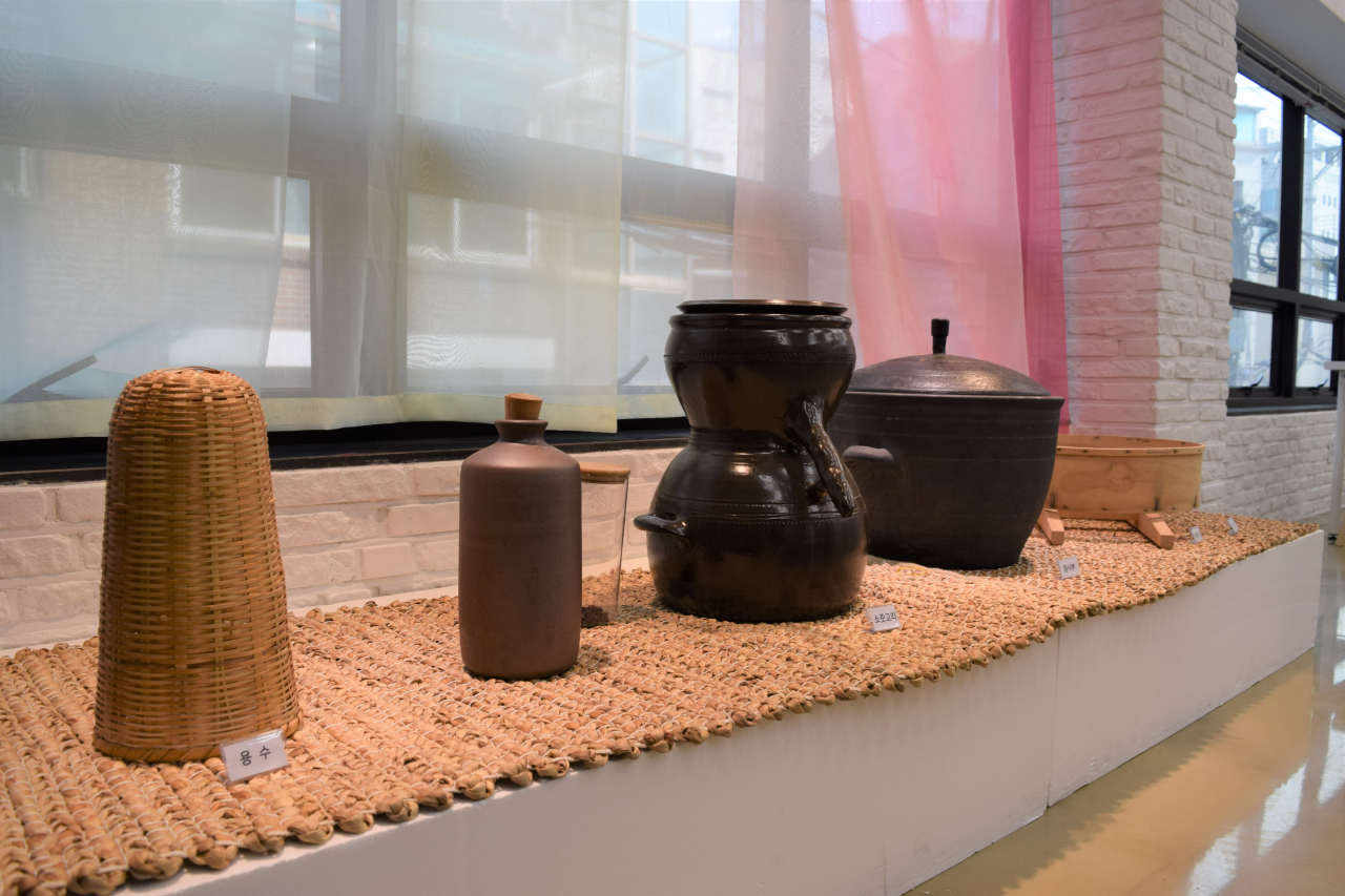 Traditional tools for making alcoholic drinks are on display at Together Brewing Together Dining's Makgeolli gallery. (Kim Hae-yeon/ The Korea Herald)