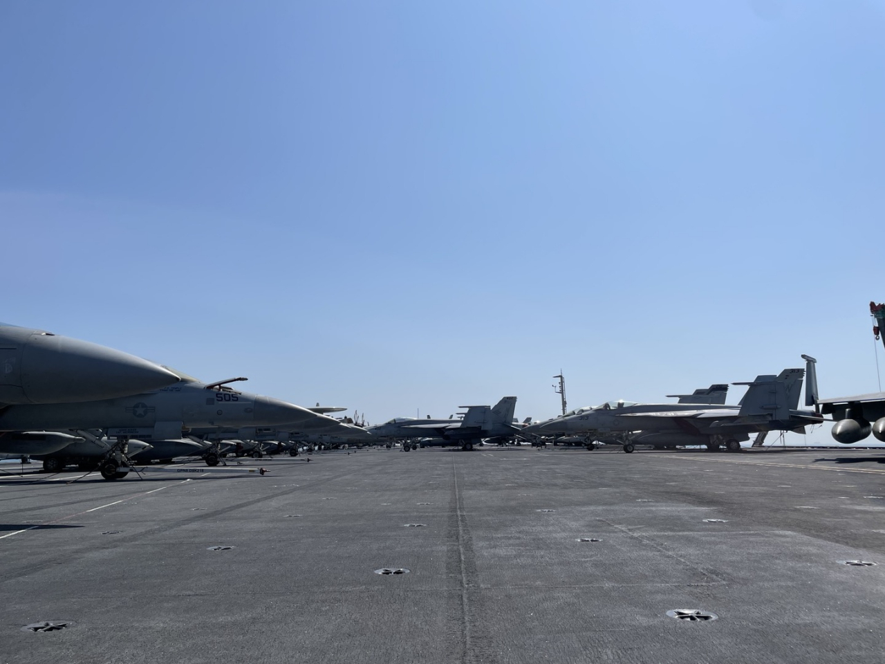 Aircraft including F/A-18 Super Hornet tactical aircraft are on standby on the deck ofthe deck of the US nuclear-powered aircraft carrier USS Nimitz, which makes a call at a naval base in the port city of Busan, 325 kilometers southeast of Seoul, on March 28, 2023. (Ji Da-gyum/ Korea Herald)