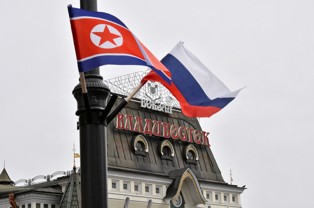 The state flags of North Korea and Russia wave in the wind on a streetpost near a railway station during North Korean leader Kim Jong-un's visit to Vladivostok, Russia on April 25, 2019. (Reuters)