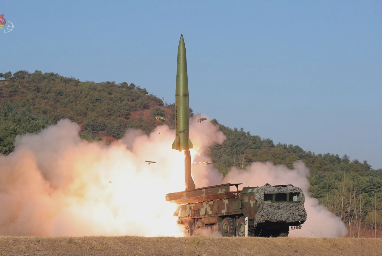 North Korea simulates nuclear attacks on South Korea and the US, using short-range ballistic missiles in this photo released by the Korean Central News Agency on Tuesday. (KCNA-Yonhap).