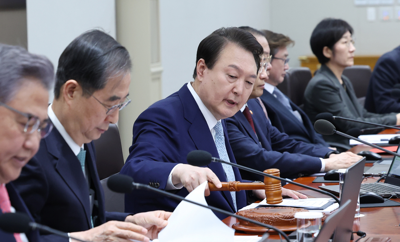 President Yoon Suk Yeol presides over a Cabinet meeting held at the presidential office in Seoul, Tuesday. (Yonhap)