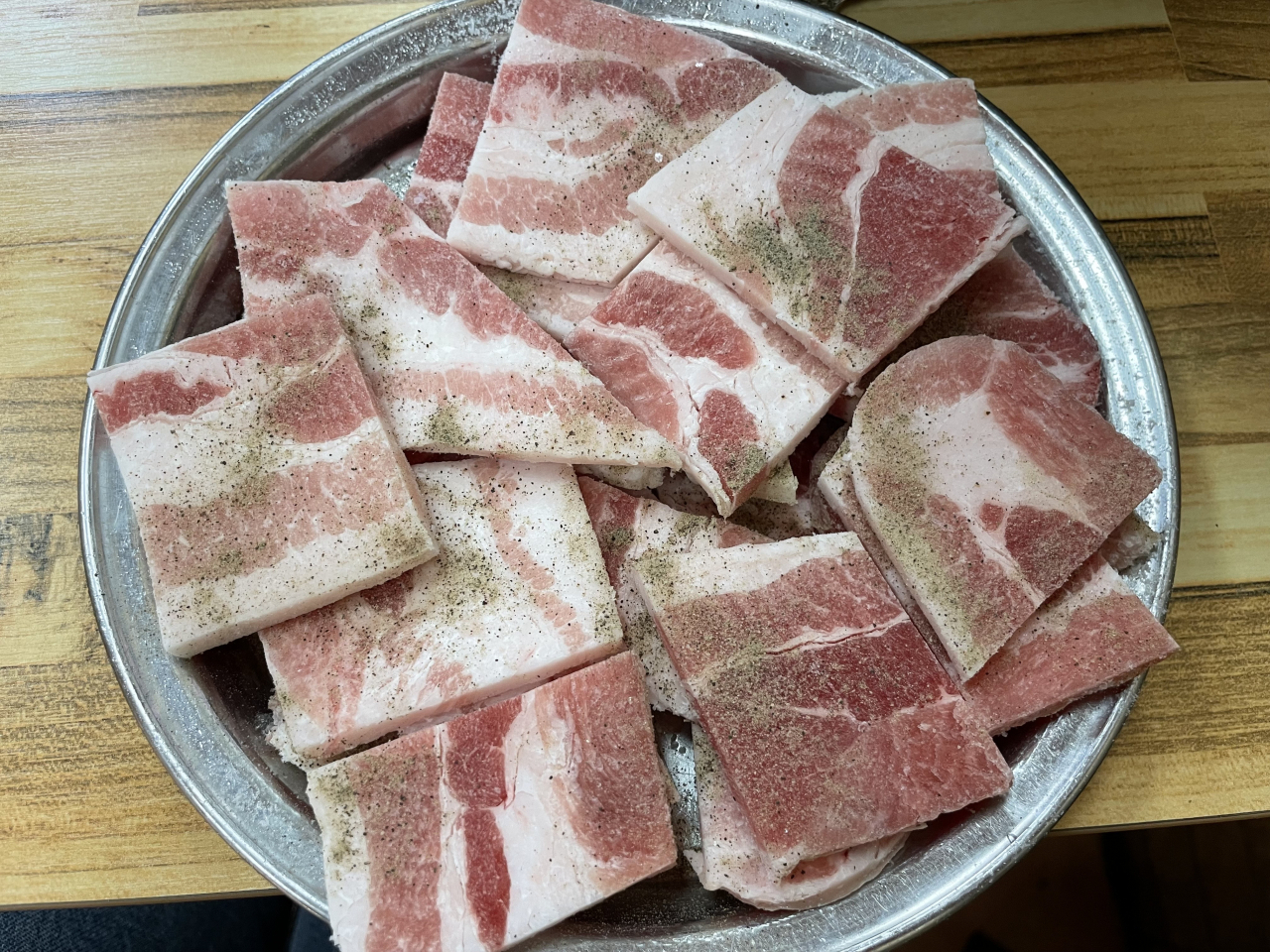 Sinchon Daegu Pork belly's signature frozen pork belly (Kim Da-sol/The Korea Herald)