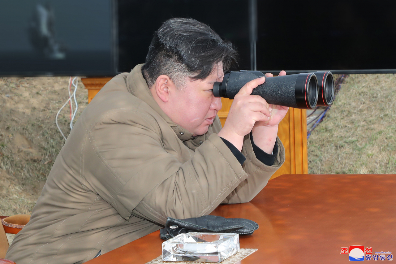 North Korean leader Kim Jong-un oversees military drills involving an underwater drone capable of delivering nuclear attacks in this photo released by the Korean Central News Agency. (KCNA-Yonhap)
