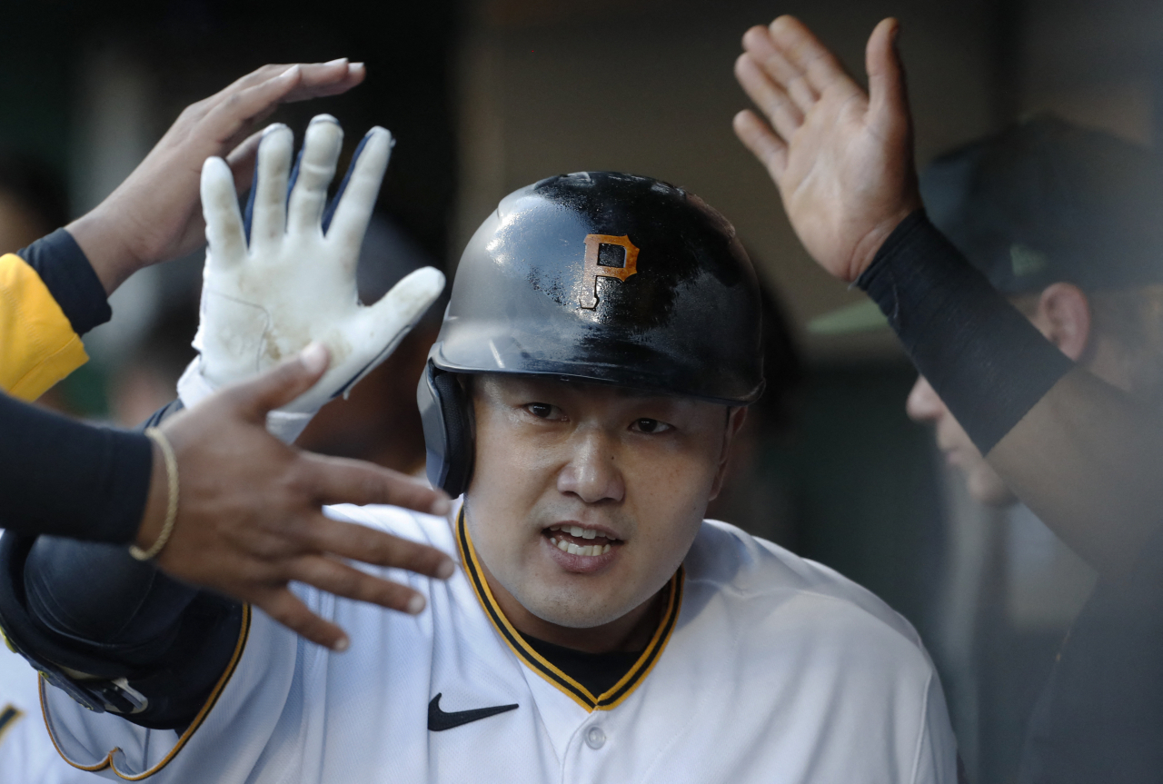 Choi Ji-man of the Pittsburgh Pirates is congratulated by teammates after hitting a solo home run against the Houston Astros during the bottom of the second inning of a Major League Baseball regular season game at PNC Park in Pittsburgh on Monday. (Reuters)