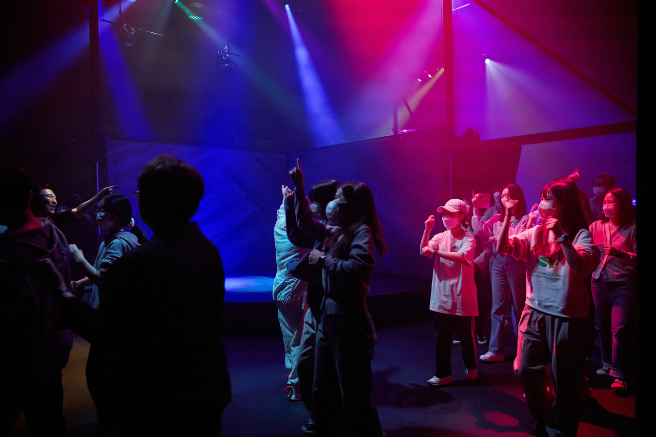 The audience dances along in the participatory show “Beyond Diverse Dimensions.” (LG Arts Center)