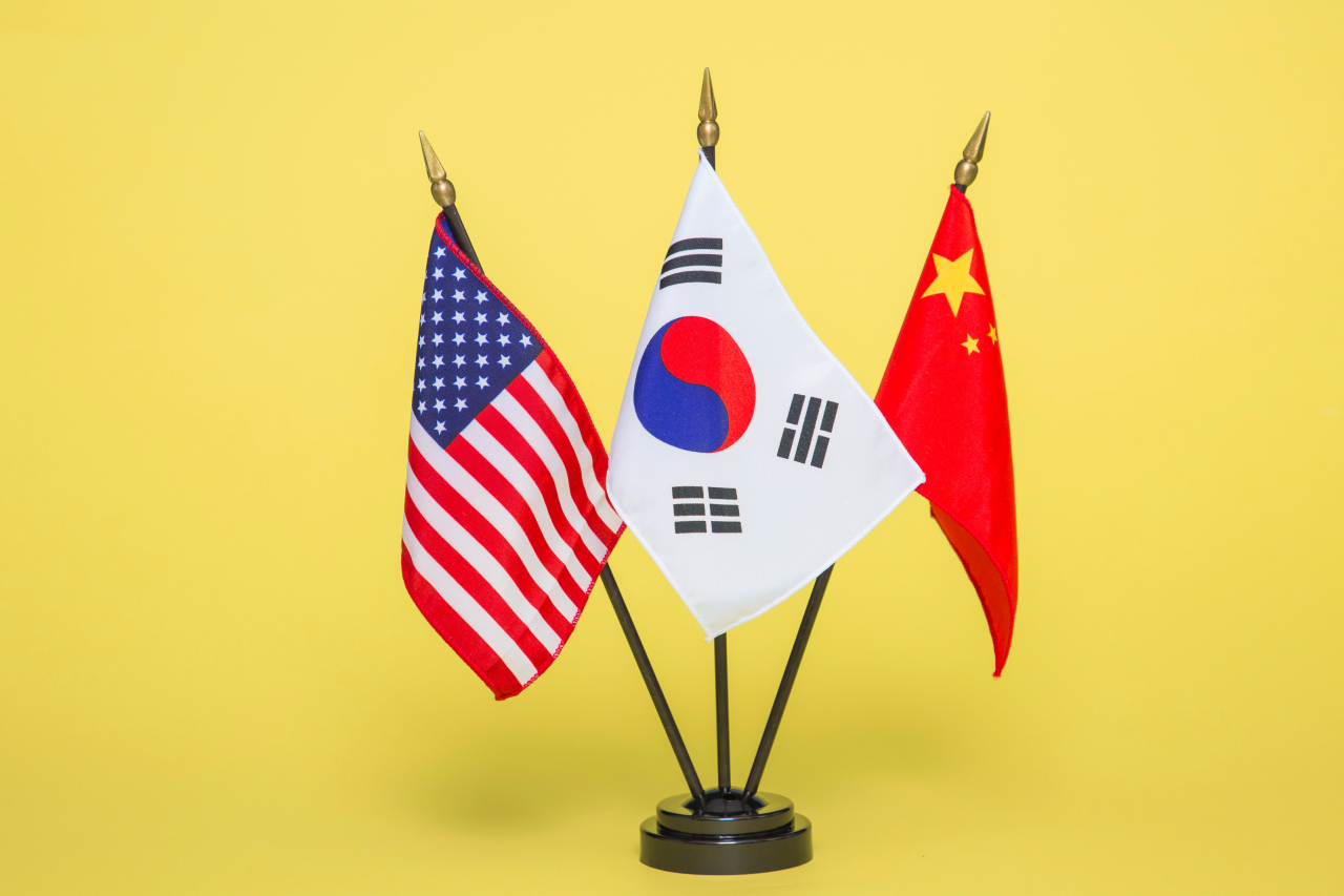 The flags of the US, South Korea and China (from left to right). (123rf)