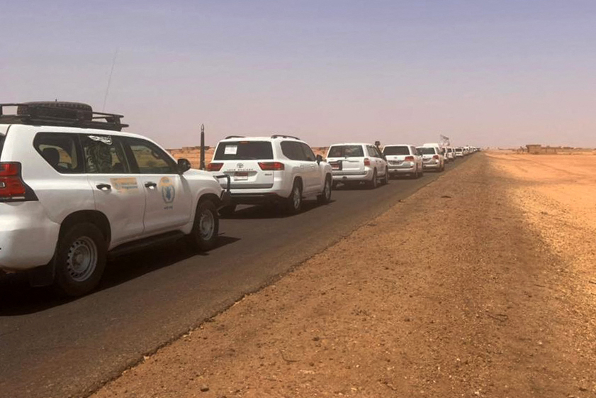A convoy leaving Khartoum advances on a road towards Port Sudan, on April 23, 2023, as people flee the battle-torn Sudanese capital. (Photo - AFP)