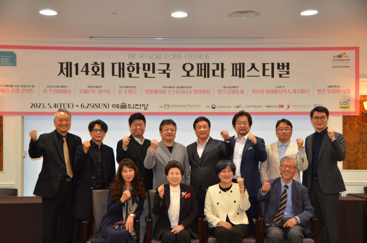 The Korea Opera Festival Organization's Chairman Shin Sun-seop (second row, fifth from left) and representatives of the participating opera companies of the 14th Korea Opera Festival pose for photos after a press conference held at the Seoul Arts Center on Tuesday. (Korea Opera Festival Organization)