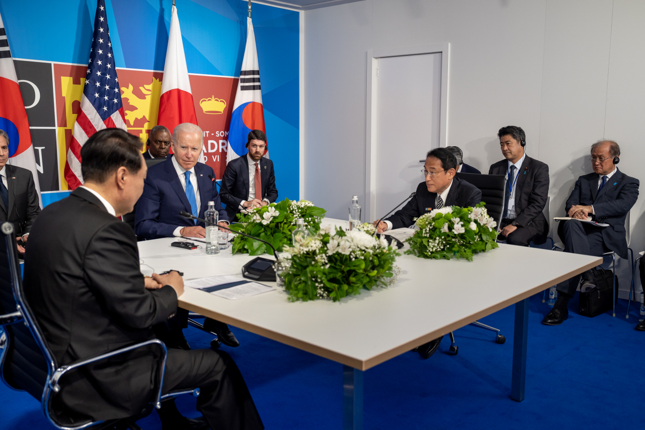 President Joe Biden attends a trilateral meeting with Prime Minister Fumio Kishida of Japan and President Yoon Suk Yeol of South Korea during the NATO Summit, Wednesday, June 29, 2022, at IFEMA Madrid in Madrid.(Photo -- White House)