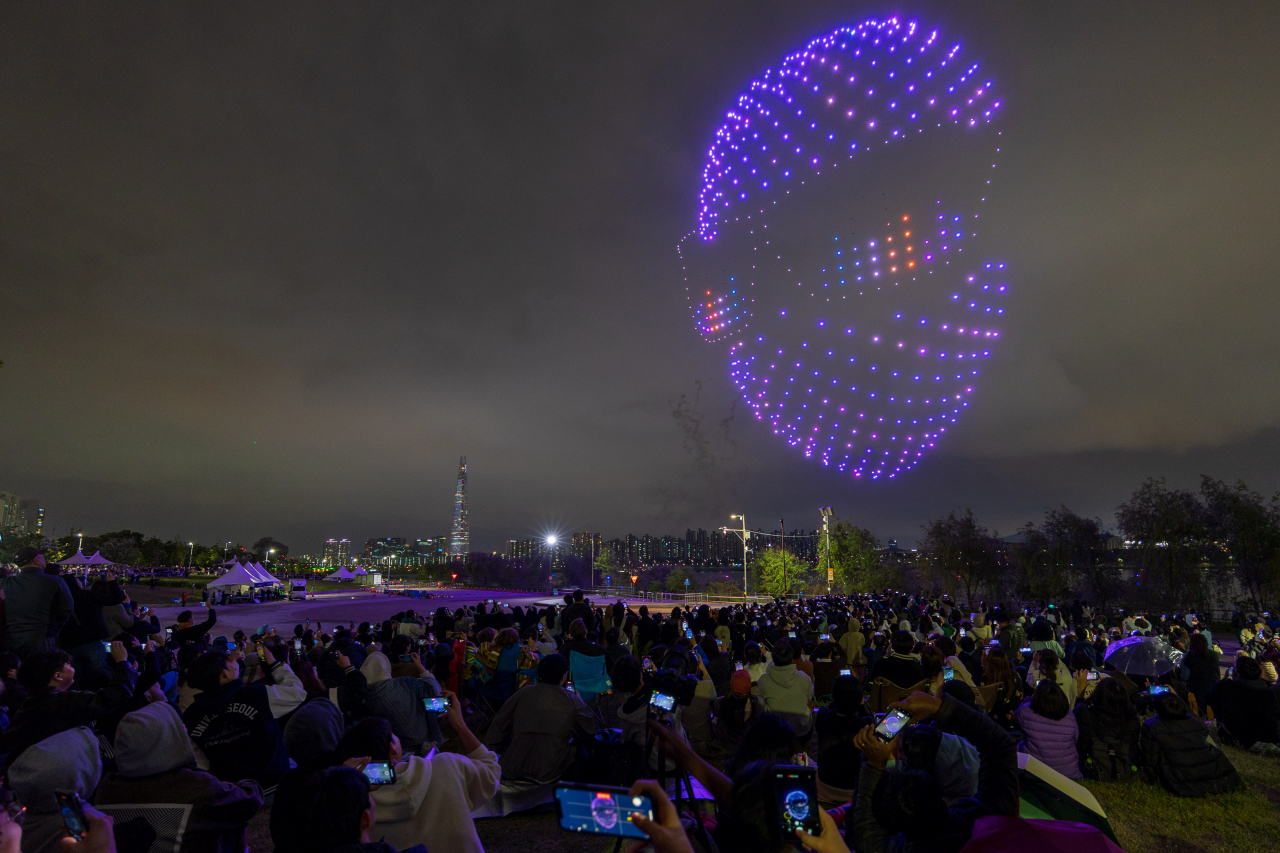 Over 500 drones illuminate the night sky during a drone light show in a park along the Han River in Seoul on Saturday. (Pablo Air/Seoul Metropolitan Government)